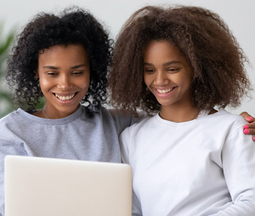 Mother and daughter with a laptop image