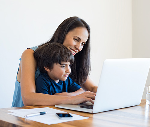 Mother and son with a laptop image