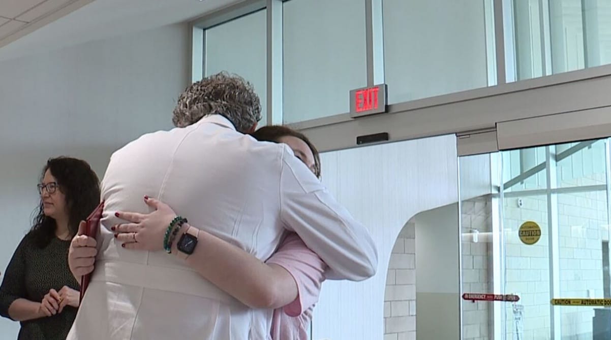 patient hugging doctor