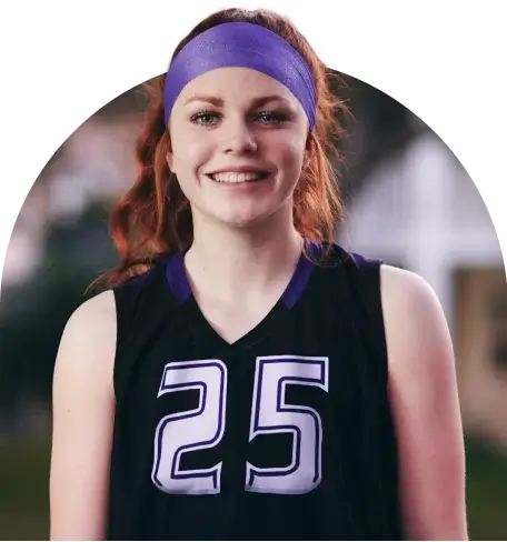 Girl smiling with a 25 on her shirt