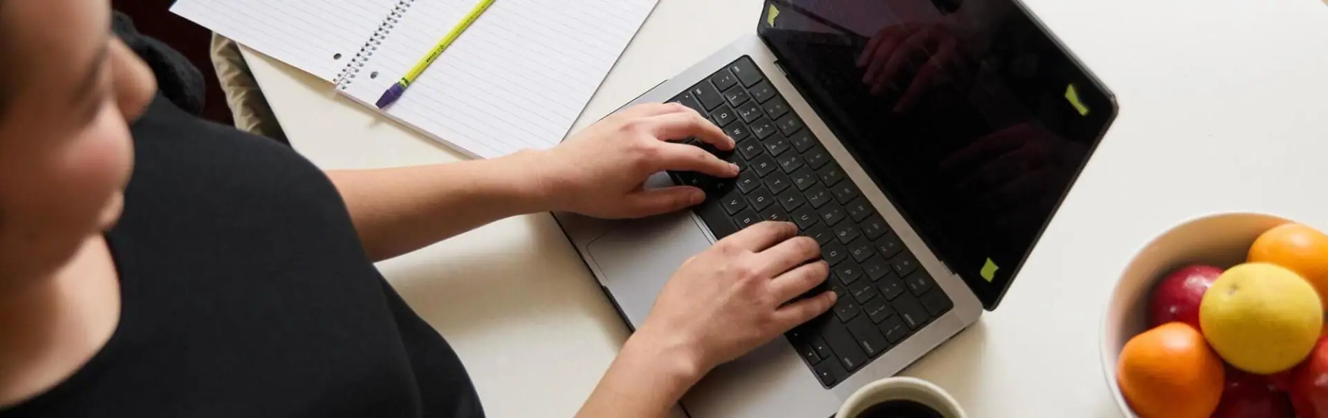 Student working with their laptop