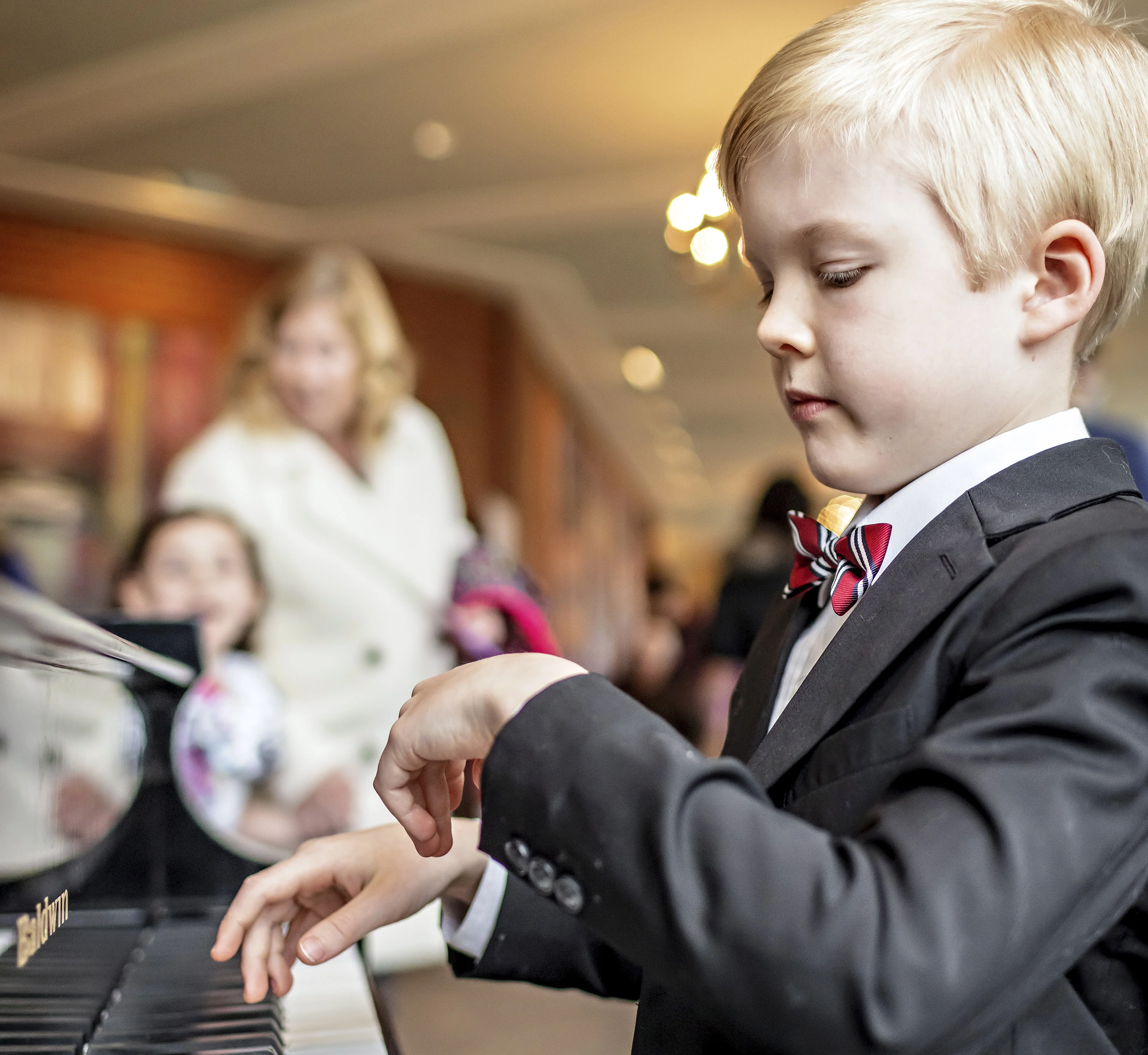 Little boy playing piano