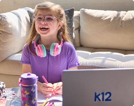 Elementary Student working with her laptop at home
